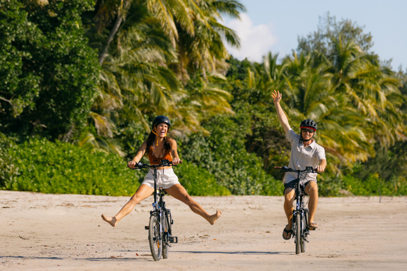 Tourists enjoy riding bikes along Four Mile Beach. Picture: Tourism Tropical North Queensland