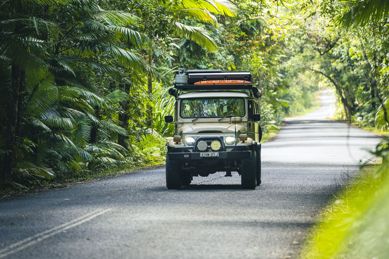 Visitors in their Toyota LandCruiser on a Daintree rainforest road. Picture: Tourism Tropical North Queensland