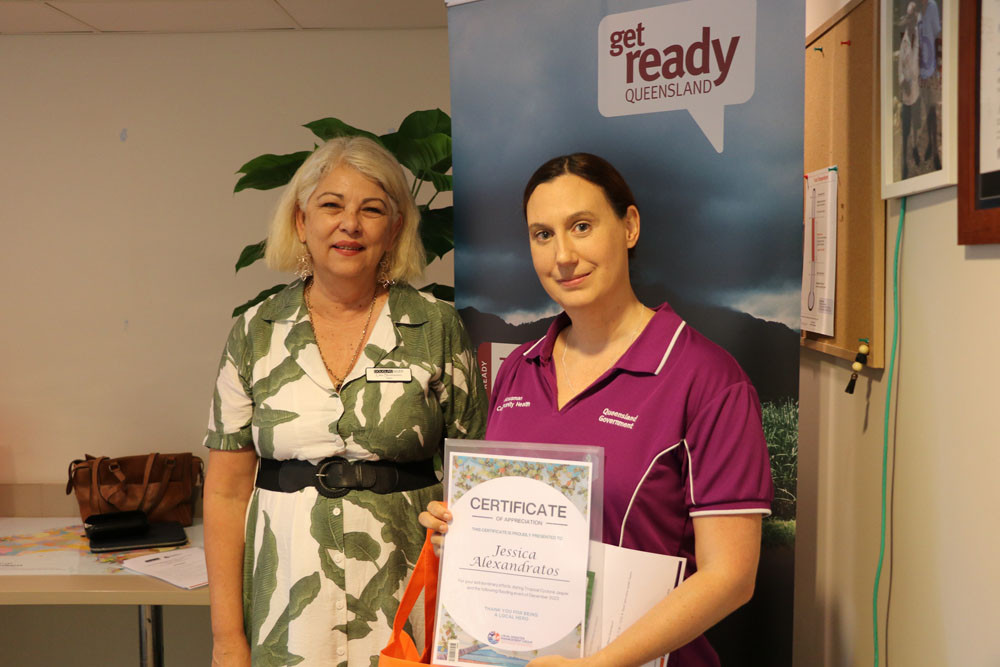 Jessica Alexandratos (right) receives her certificate of appreciation from Douglas Shire Mayor Lisa Scomazzon. Picture: Supplied