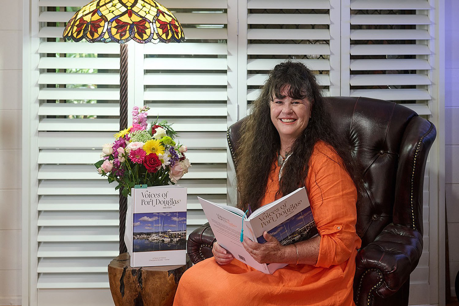 Author Cherylene Brooke-Turner with copies of her book ‘Voices of Port Douglas and Shire – A Piece of History Volume 1’ which took 21 years to bring to fruition. Picture: Supplied