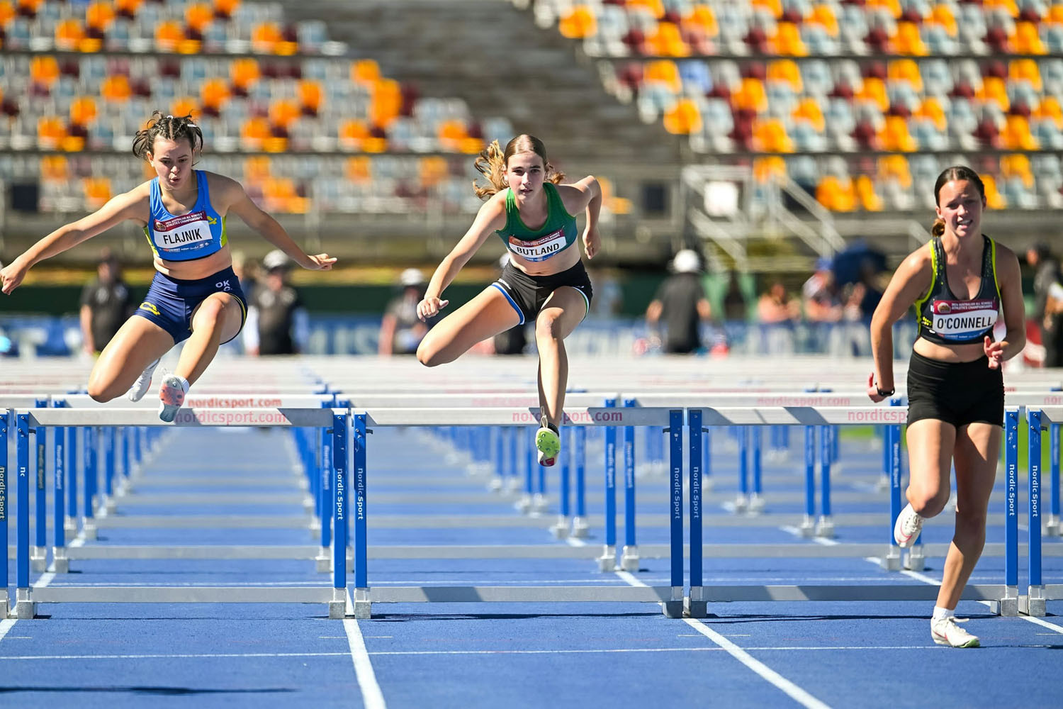 Caitlyn Butland (centre) is an accomplished hurdler. Pictures: Supplied