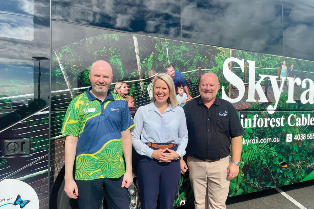 Skyrail’s Richard Berman-Hardman (left), Barron River MP Bree James and Colin Anderson of Tropic Wings with the new coach. Picture: Supplied