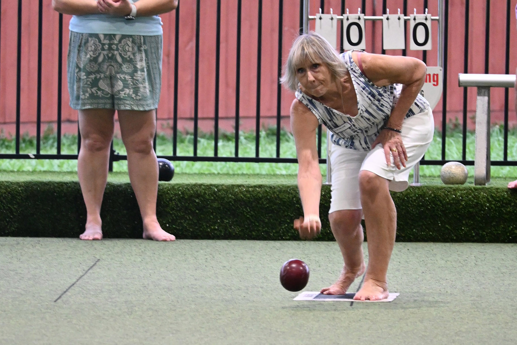 Probus member Lorraine Potter tries bowls.