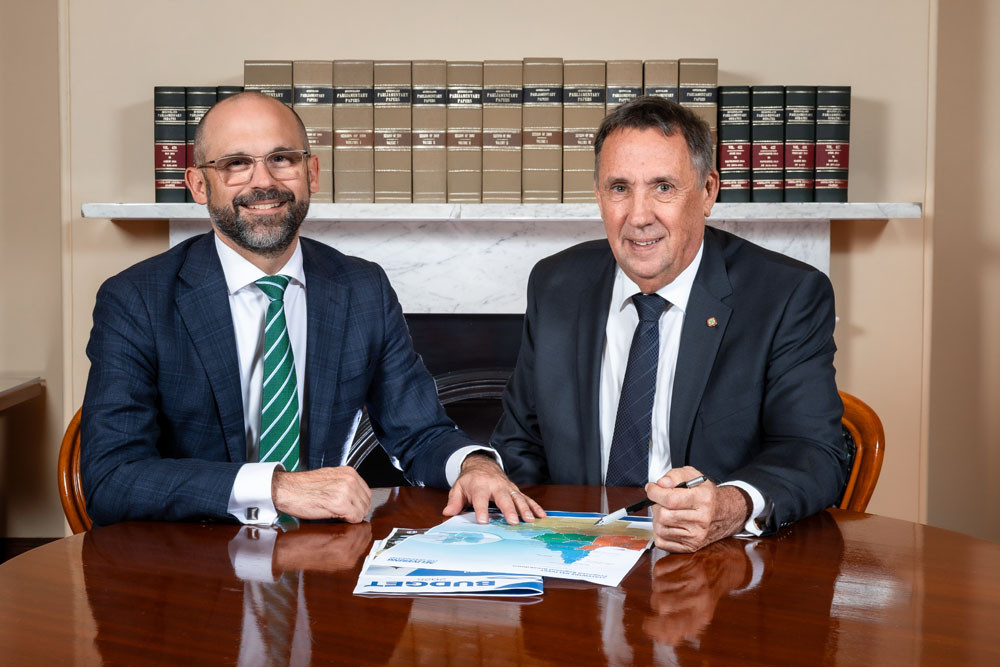 State Treasurer David Janetzki (left) and Member for Cook David Kempton go through the budget papers at Parliament House. Picture: Supplied