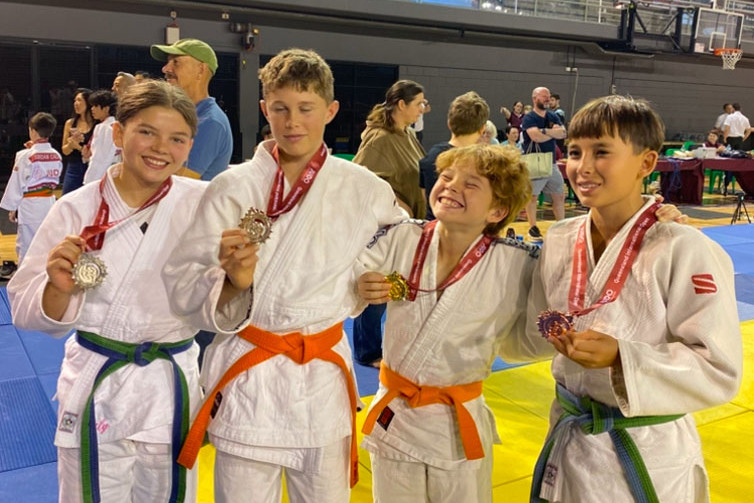 Lillie Schmidt (left), Mitchell Carbis, Harry Schmidt and Ricki Anderson of the Coral Coast Judo Club. Picture: Supplied