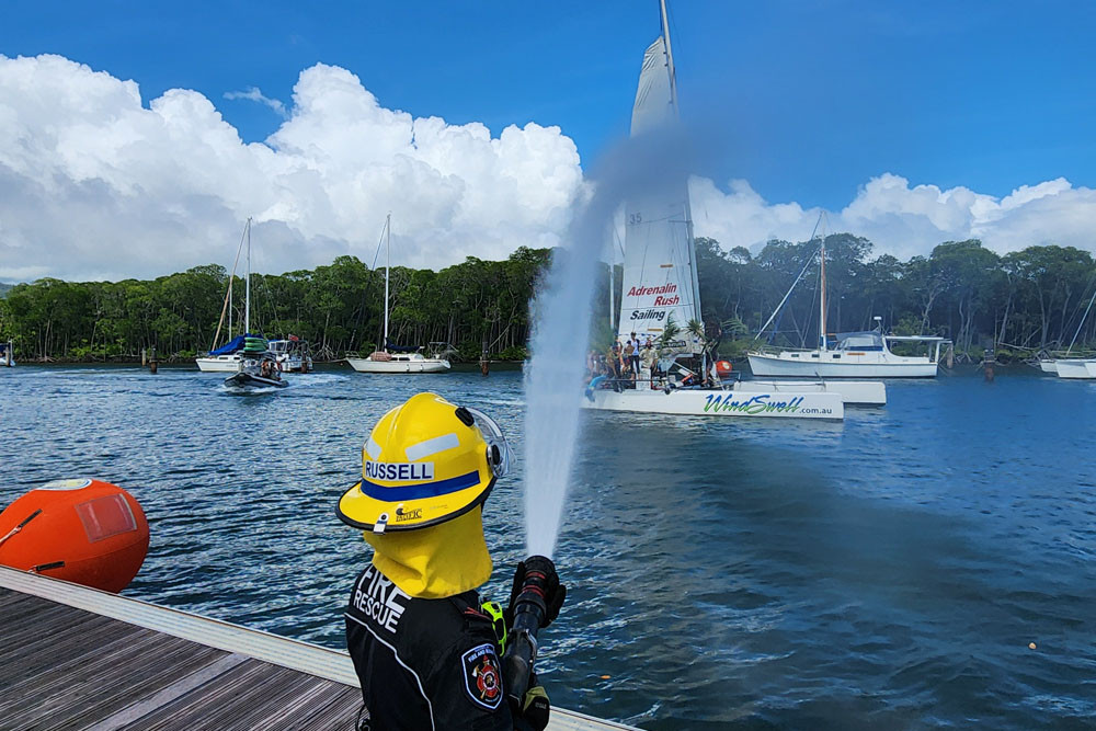 The Queensland Fire Department provided an apt starting line as WindSwell sails past. Picture: Gary ‘Gazza’ McIlroy