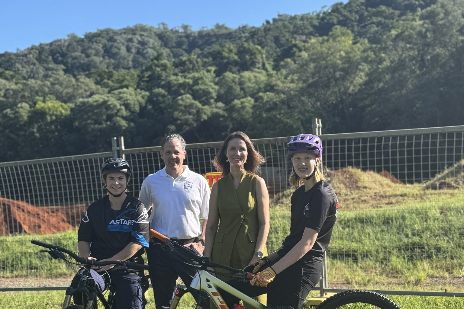 At the Crankworx ground from left world mountain bike champion Tracey Hannah, Tourism Tropical North Queensland CEO Mark Olsen, Cairns Mayor Amy Eden and Crankworx Cairns 2024 U15 downhill champion Kara Elepfandt. Picture: Supplied