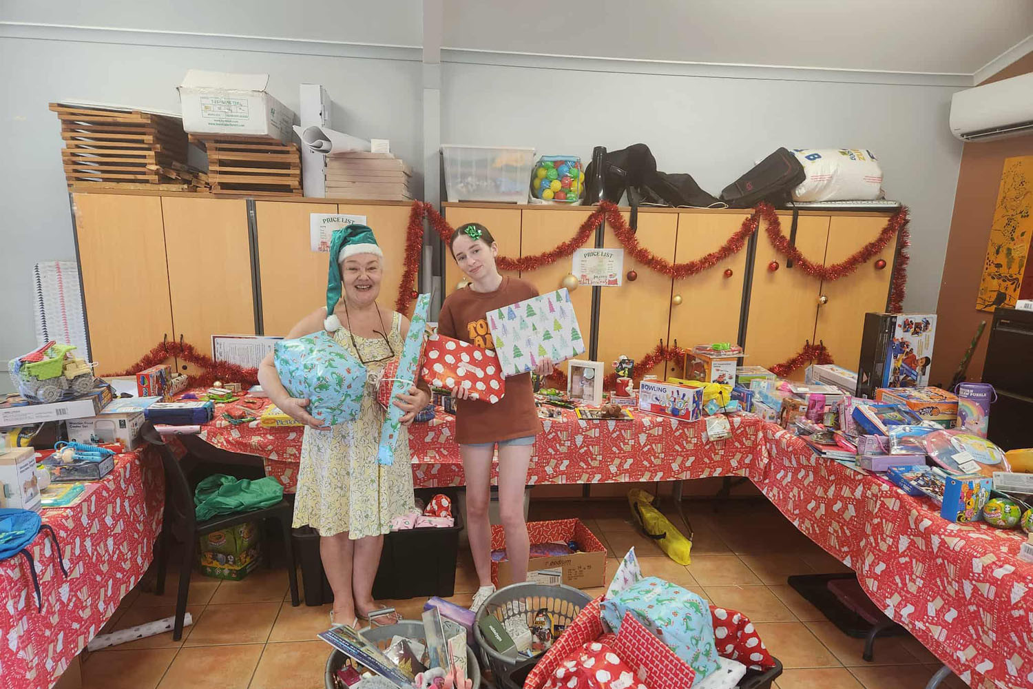 Last year’s toy store with helpers Paige McCarthy (left) and Gabi Szegedy. Picture: Supplied