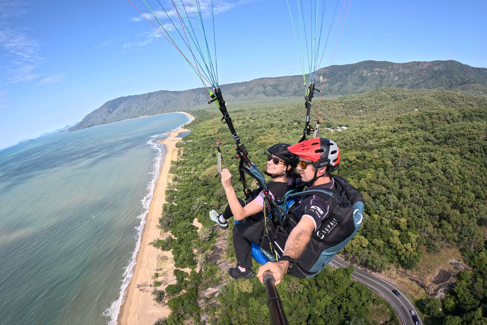 Tandem paragliding above Wangetti Beach returns in June. Picture: High Adventure Paragliding