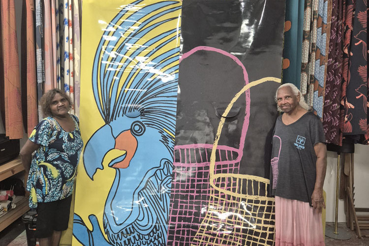 Yalanji Arts artists Lorna Shuan (left) and Margaret Rocky with their colourful street banners.