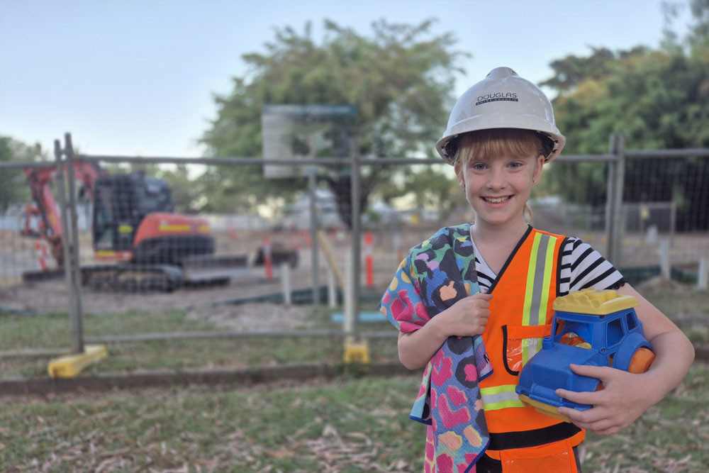 Miallo youngster Madeleine (surname withheld) surveys the progress at the Port Douglas Splash Park site. Picture: Douglas Shire Council