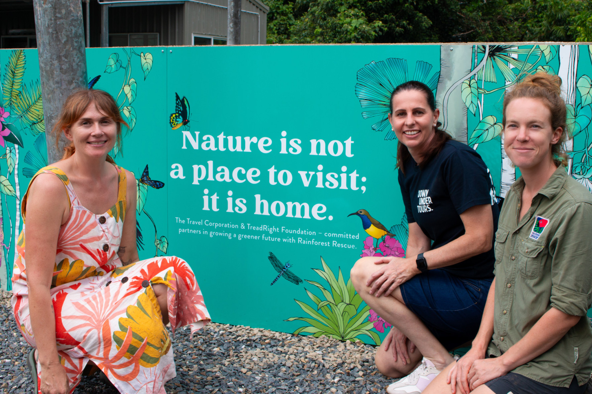Victoria McGrane (left), Erin Simpson and Marine Deliens in front of the mural at RR native nursery. Picture: Skye Young