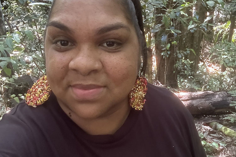 Nikisha Missionary models some of the earrings she has made from natural materials. Pictures: Supplied