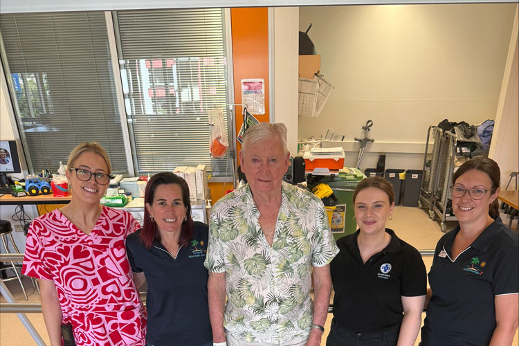 Colin Andreasson (middle) with members of the Cairns Hospital rehabilitation team. Picture: Cairns and Hinterland Hospital and Health Service