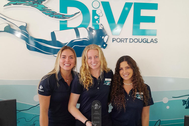 Quicksilver Dive instructors (from left) Leah van Beekhuizen, India Strong and Jade Parton show off the global award. Picture: The Quicksilver Group