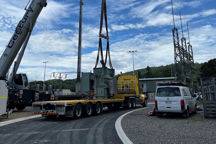 A crane lifts a transformer off a semi-trailer at Mossman. Picture: Ergon Energy