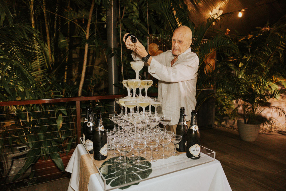 Grahame Wearne starts the champagne tower. Pictures: Sand and Soul Photography