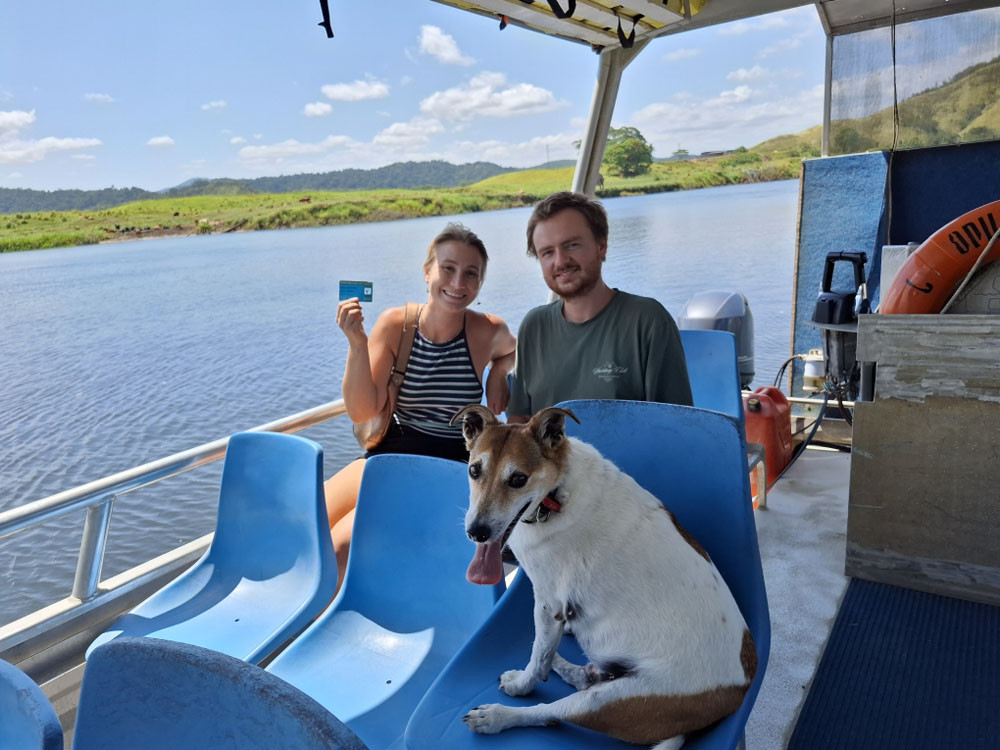 Edith Daube, Antoine Markey and Jack the dog with the Douglas Card on board Crocodile Express.