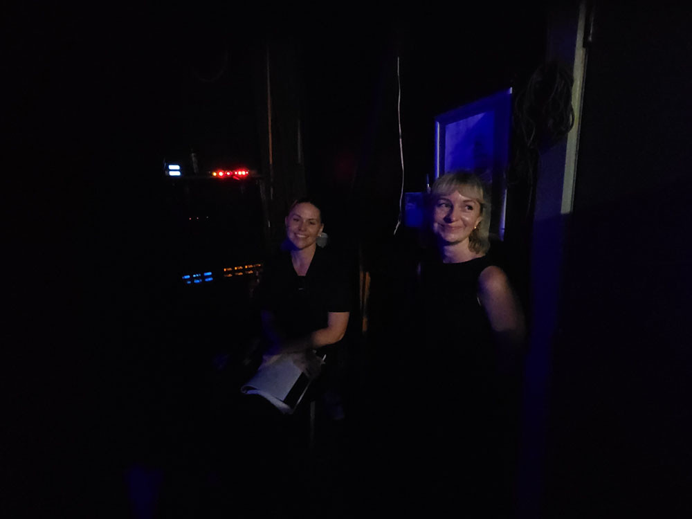 The back stage team compare notes.